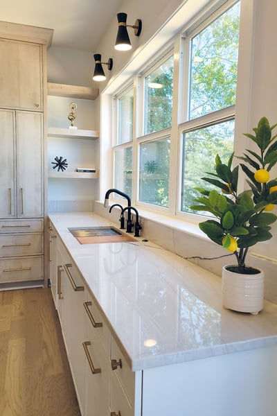 Custom kitchen featuring granite countertops and built-in shelving
