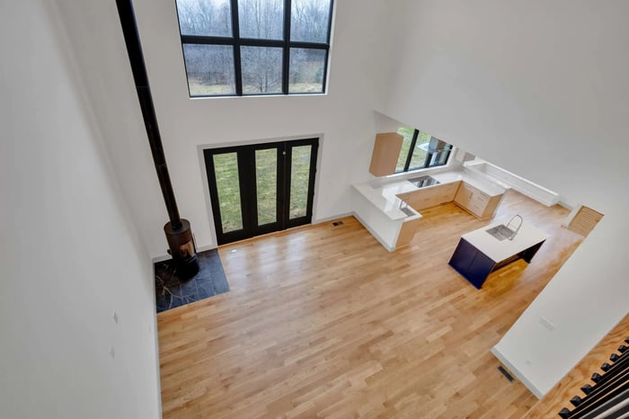Custom LEED Gold-Certified Smart Home view from second story catwalk over living room entertainment area