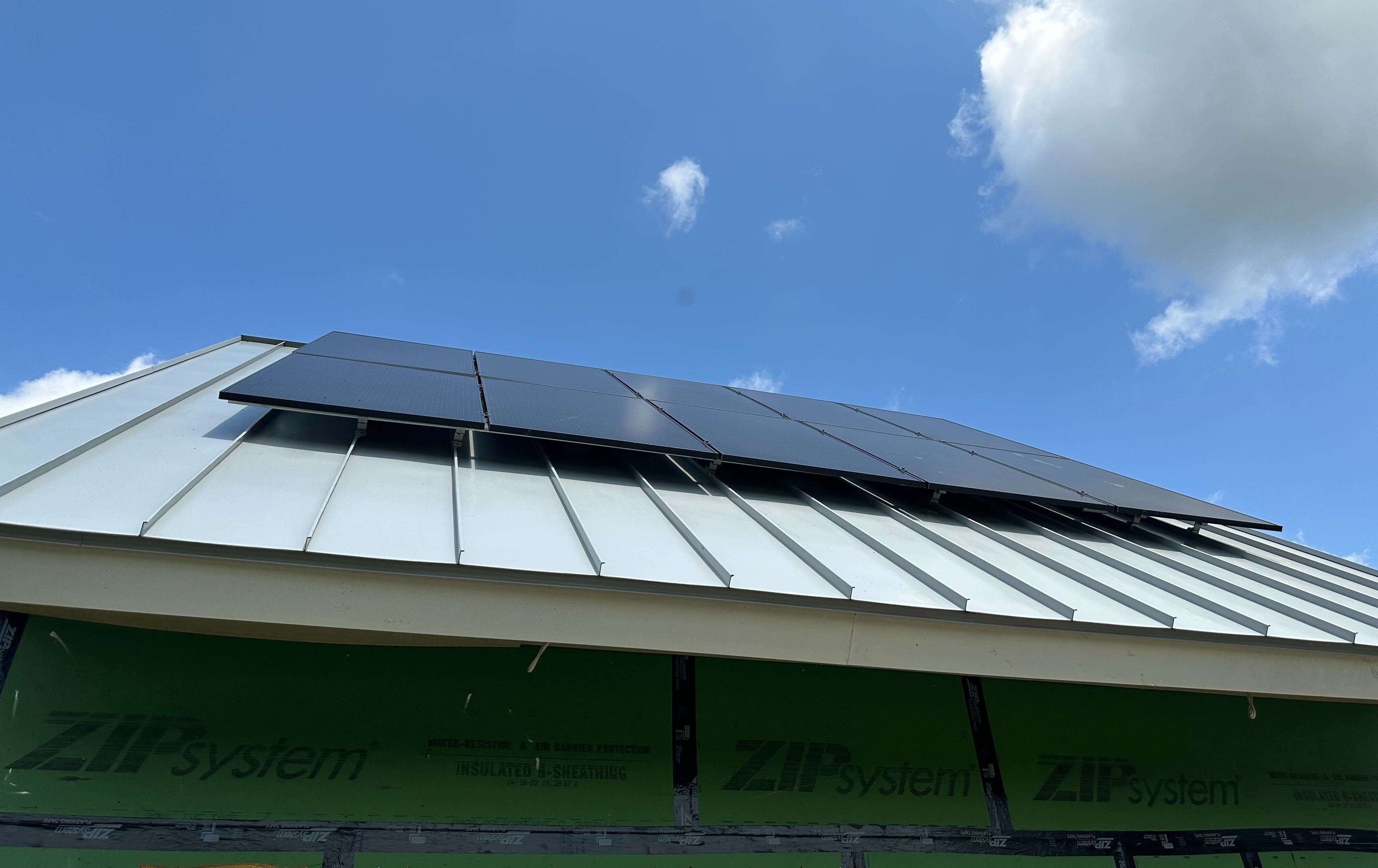 Metal roof with solar panels