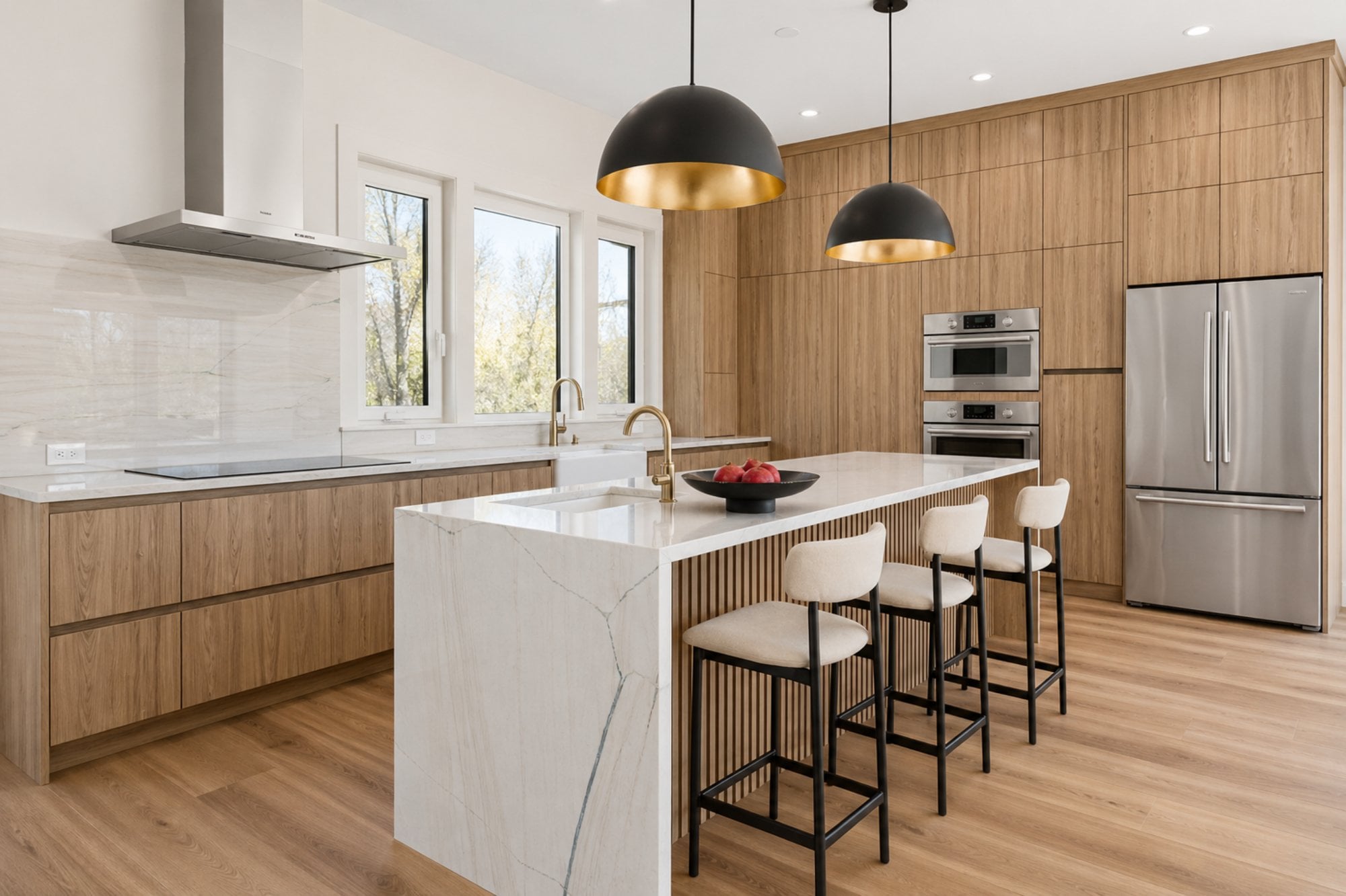boyds modern kitchen by august homes warm wood cabinetry kitchen with large island pendant lighting and stainless appliances