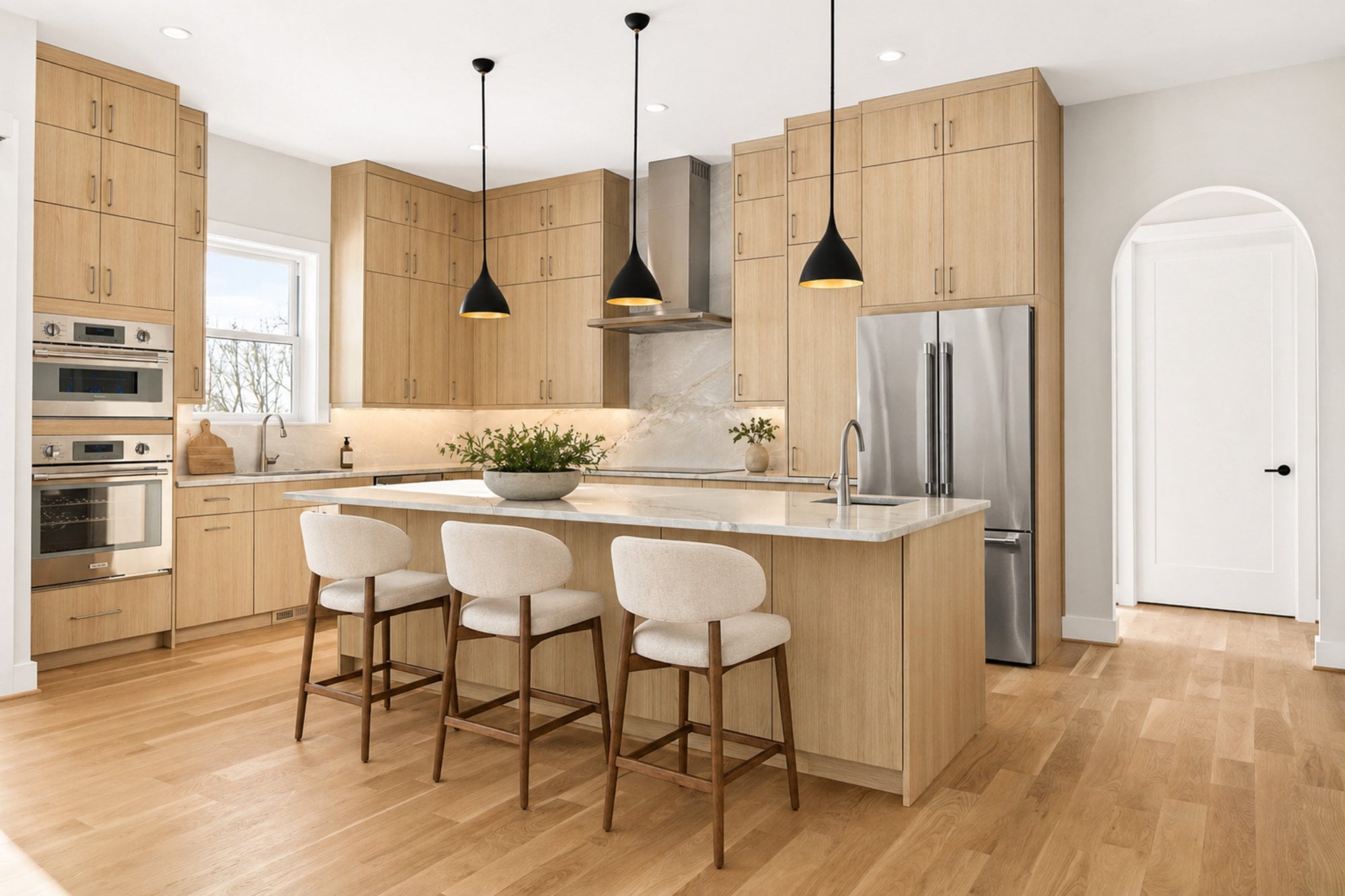 boyds multigenerational kitchen by august homes bright kitchen with light wood cabinets large island and modern pendant lighting